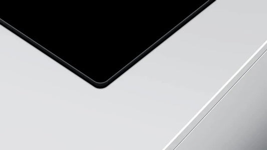 Close-up of a car's black roof and white body