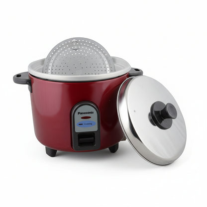 Red rice cooker with a steamer basket on a white background